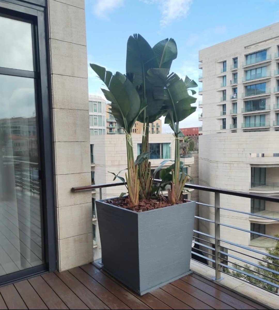 Garden design on a balcony with our pots and plants